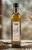 Olej_czosnkowy_500ml_Madejowe_Pole_w_kuchennej_aranżacji_z_czosnkiem_w_tle
